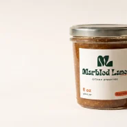 Marbled Lane artisan preserves jar with monochrome forest green label design tested in the Recraft AI for packaging labels review.